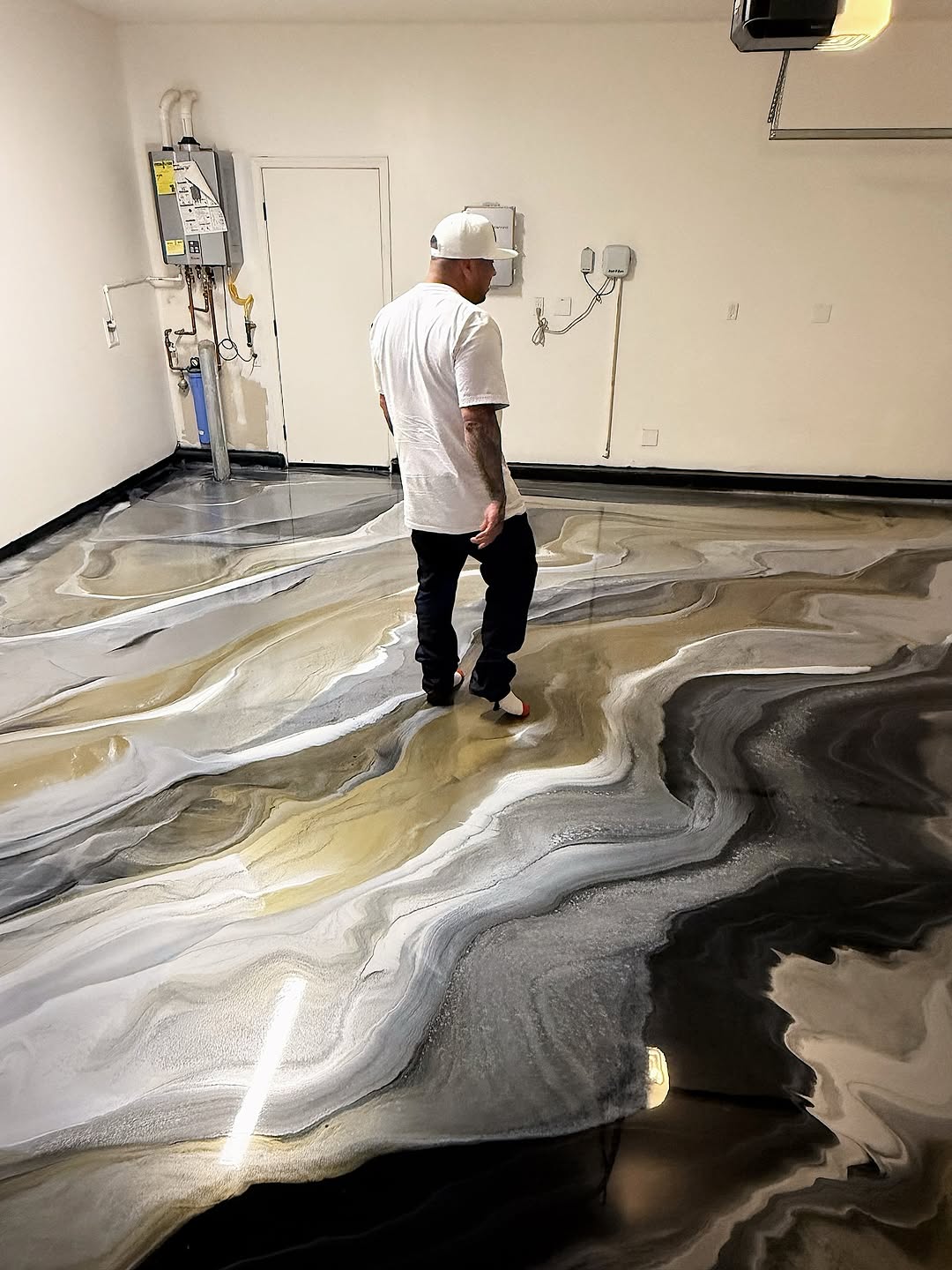 Professional epoxy garage floor coating with metallic finish in California