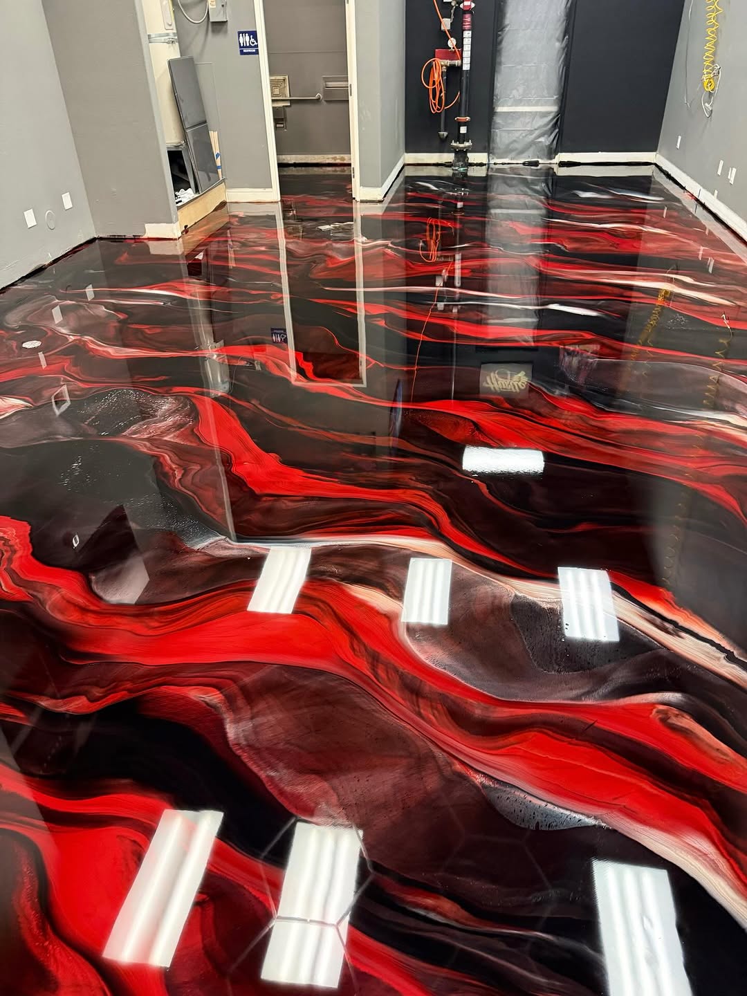 Retail store with light-reflective epoxy floor creating bright, open atmosphere