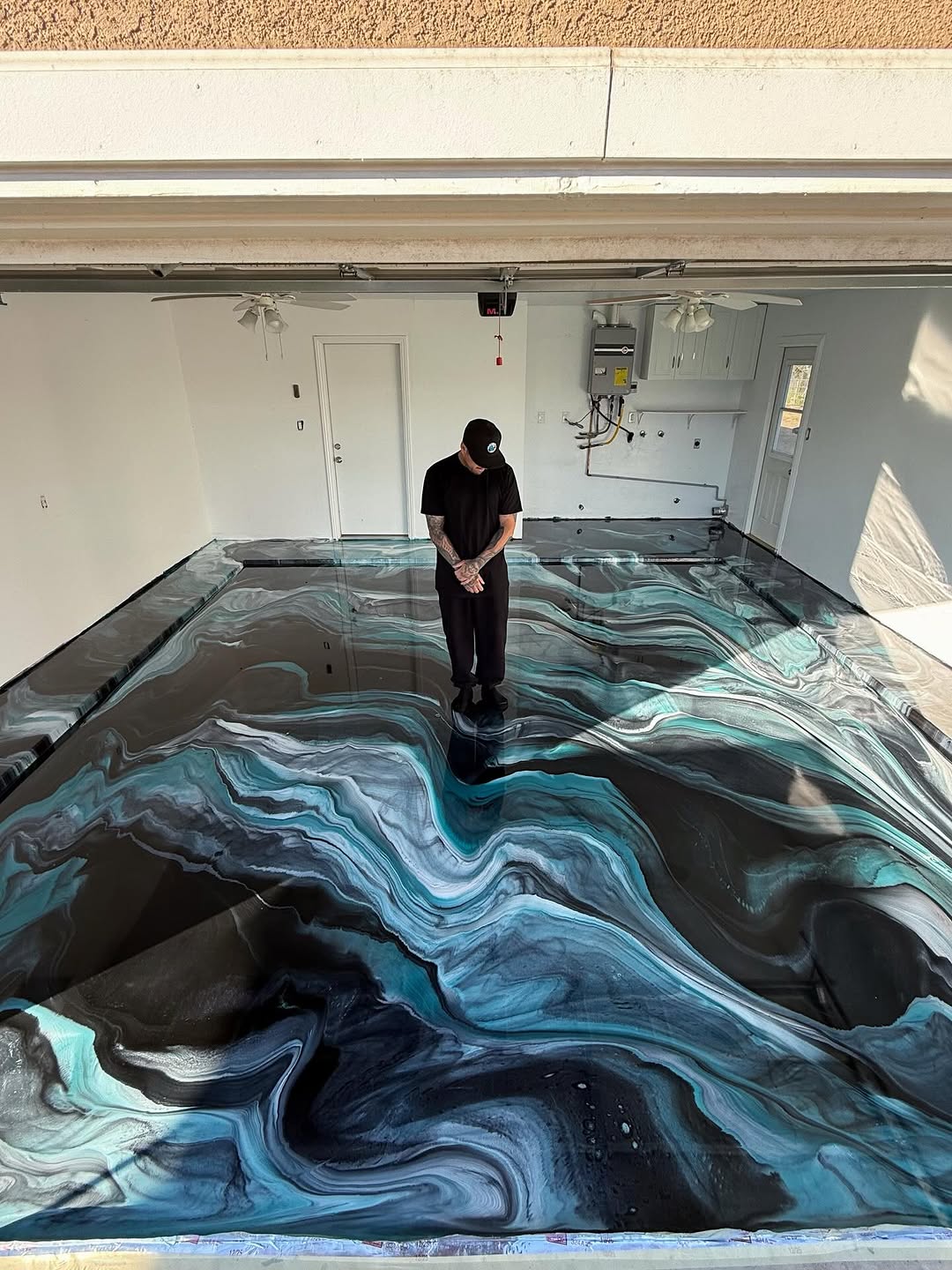 Close-up of metallic epoxy pigment swirls showing three-dimensional depth