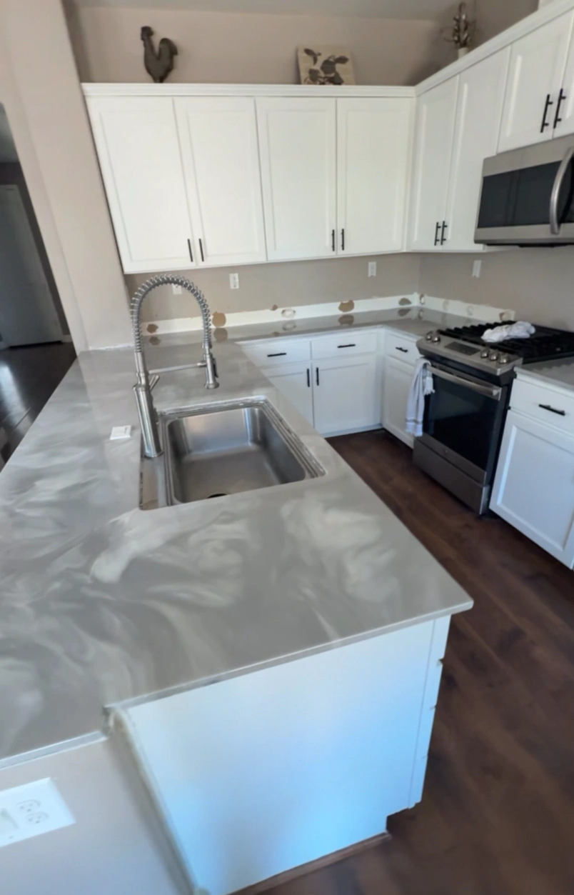 Custom resin countertop with marble veining in a California kitchen